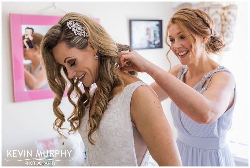 bride putting on her dress